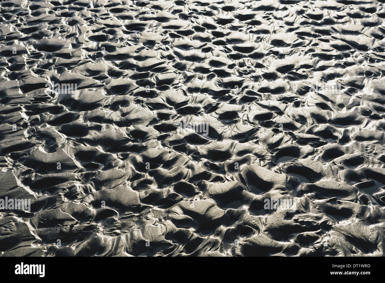 Close up of erosional sand patterns on beach and intertidal zone Ocean Park Stock Photo