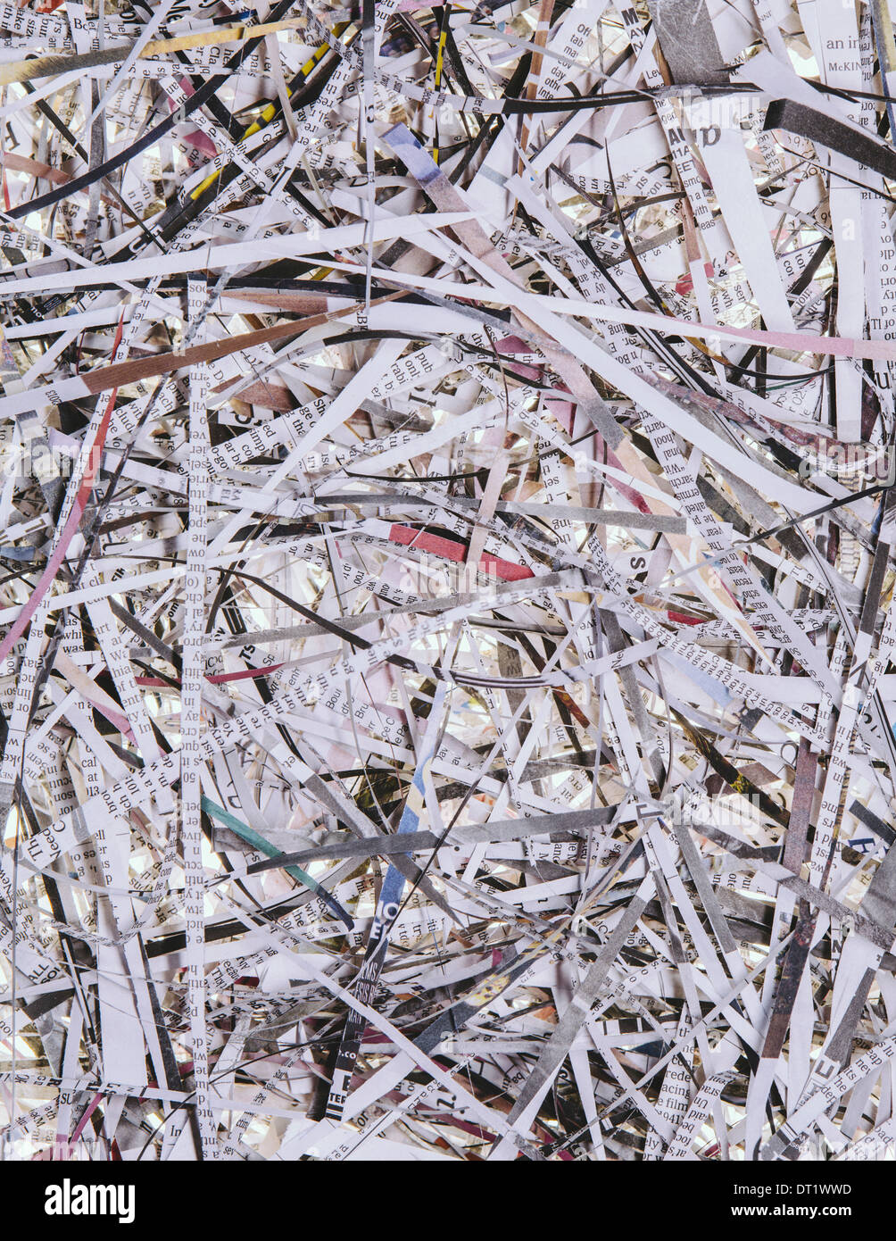A pile of long thin shredded pieces of printed newspapers Stock Photo