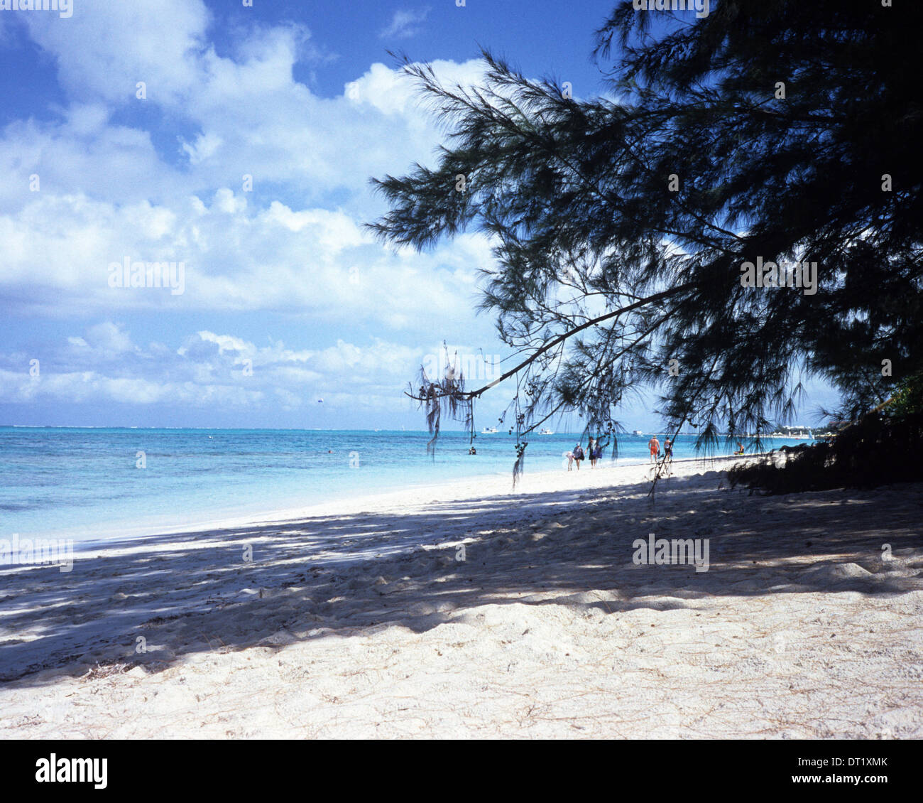 Blue skies, blue water, soft white sand, some shade from the sunshine, this is the beach on Grace Bay. Providenciales, T.C.I. Stock Photo