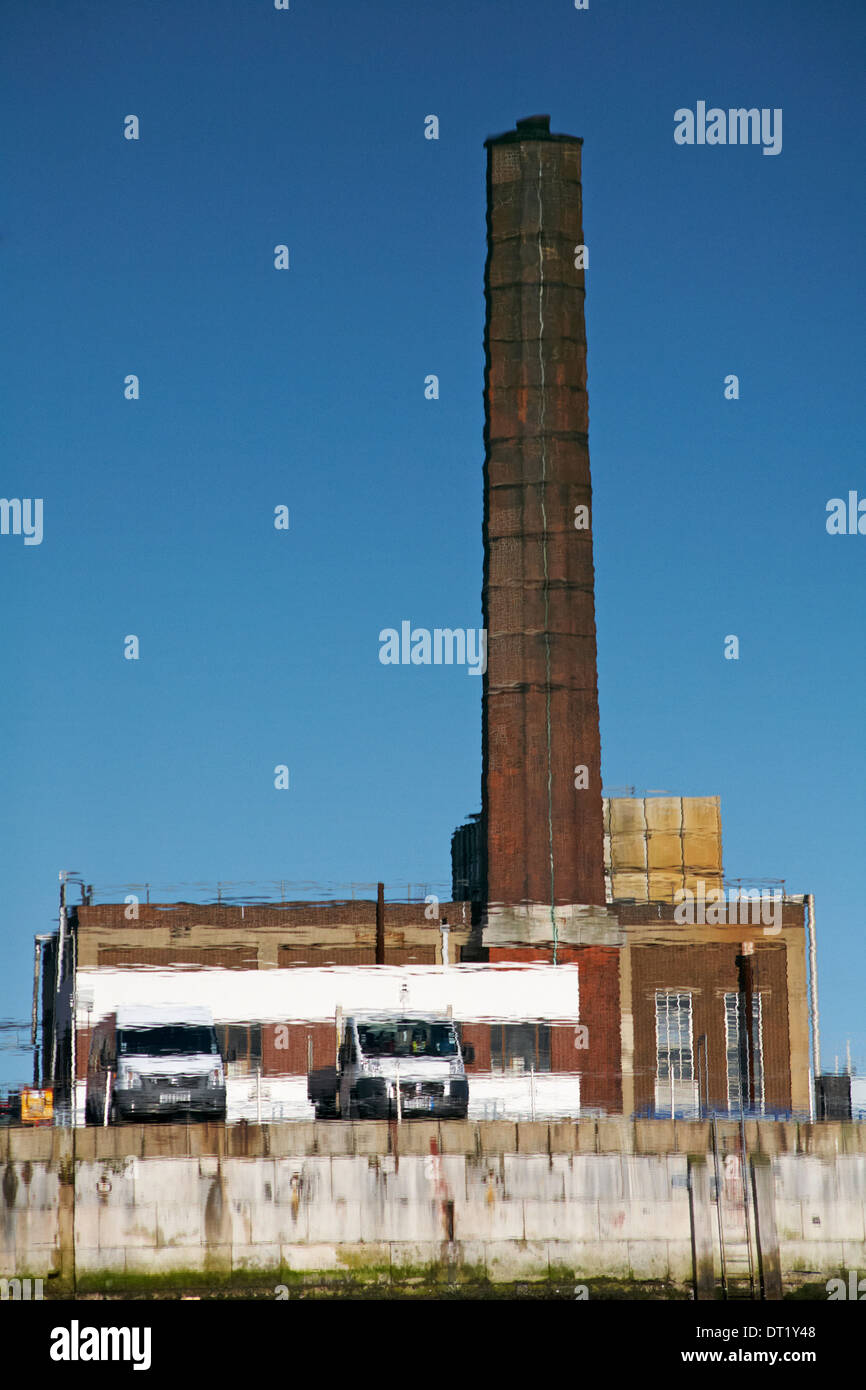 Inverted reflections of chimney, building and vans at Portsmouth in January  Stock Photo - Alamy