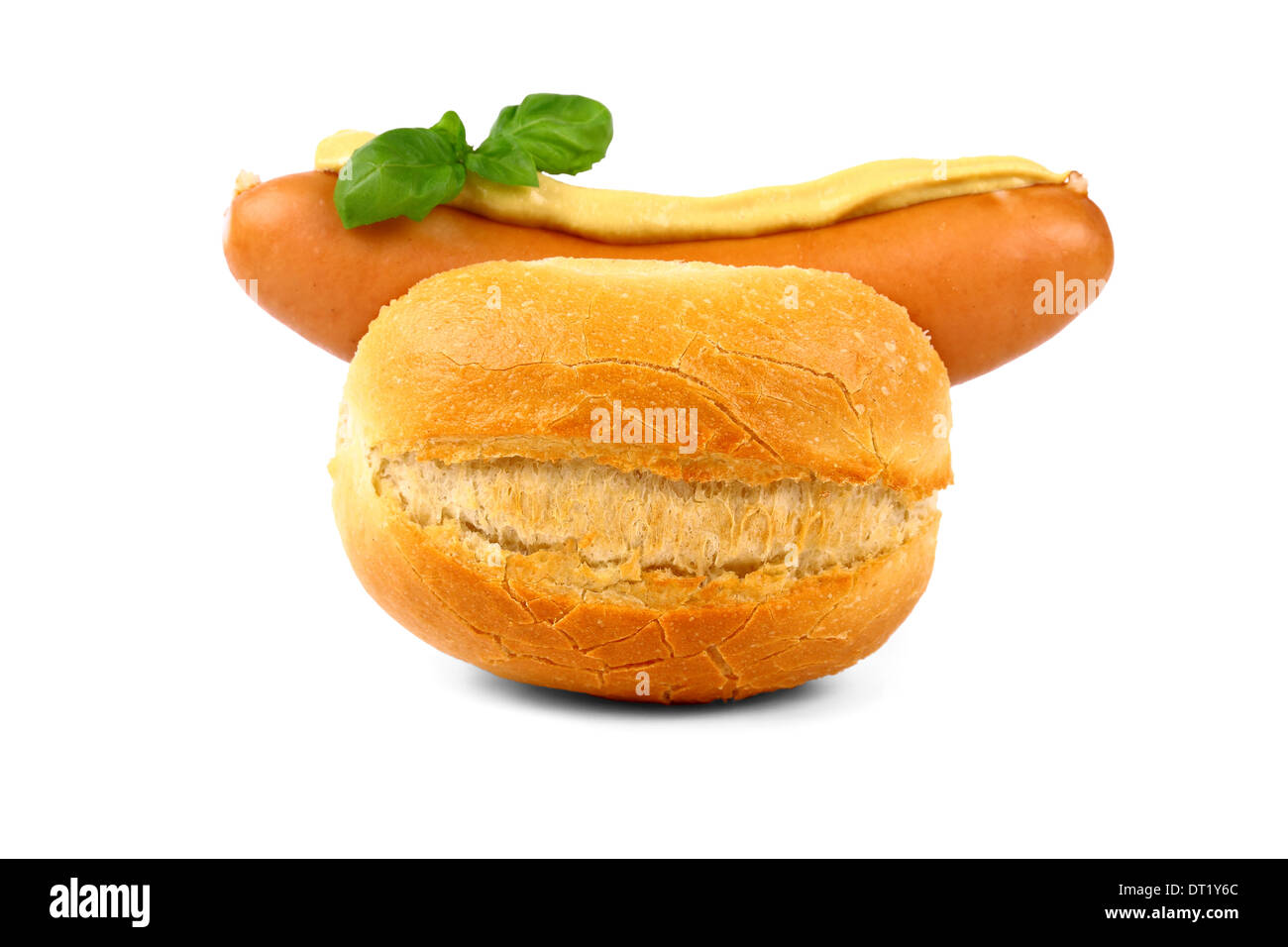German sausage with bun, mustard and basil, isolated Stock Photo Alamy