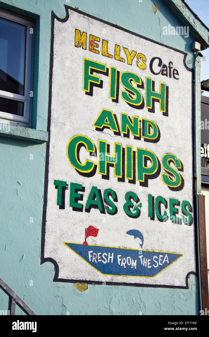 Killybegs fishing port County Donegal Ireland A hand painted sign fish and chips teas and ices fresh from the sea at Mellys cafe Stock Photo