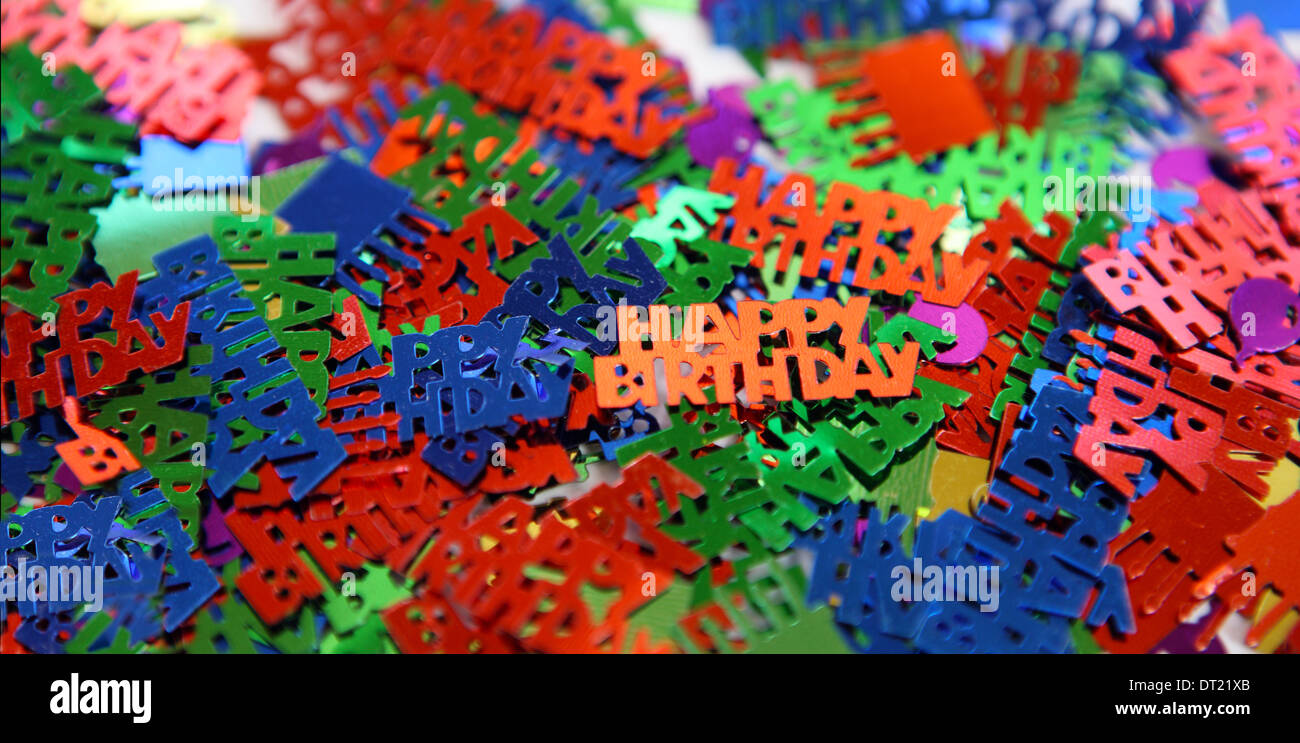 Happy Birthday confetti table decorations Stock Photo