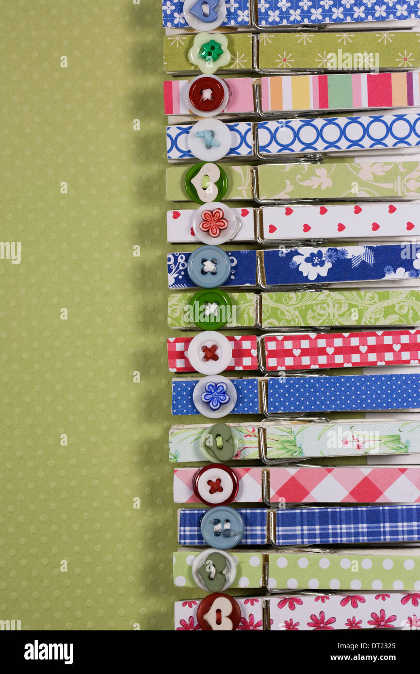 Decorative peg pattern on a green spotty background. Stock Photo