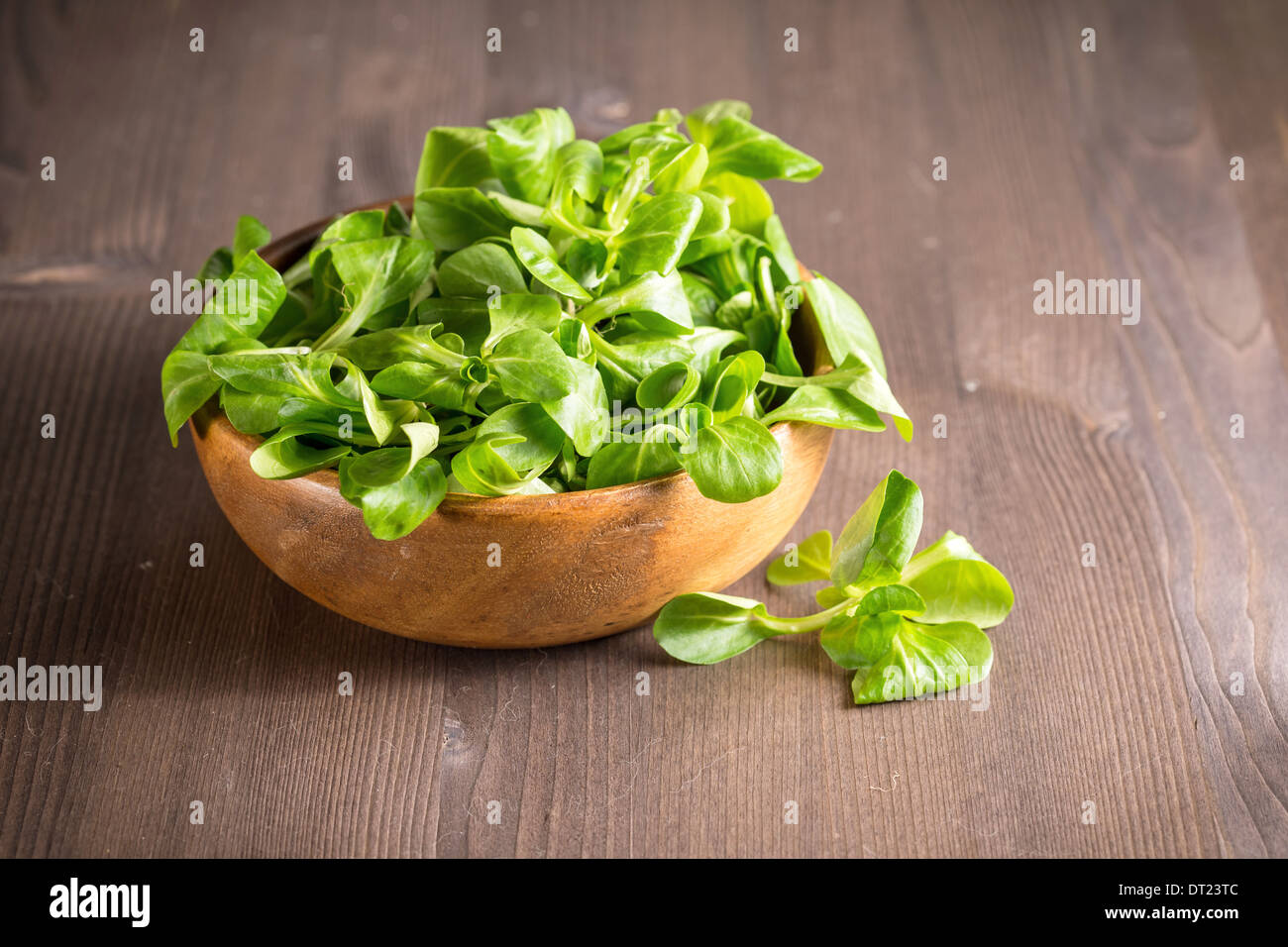 Corn salad in a wooden bowl on the table Stock Photo