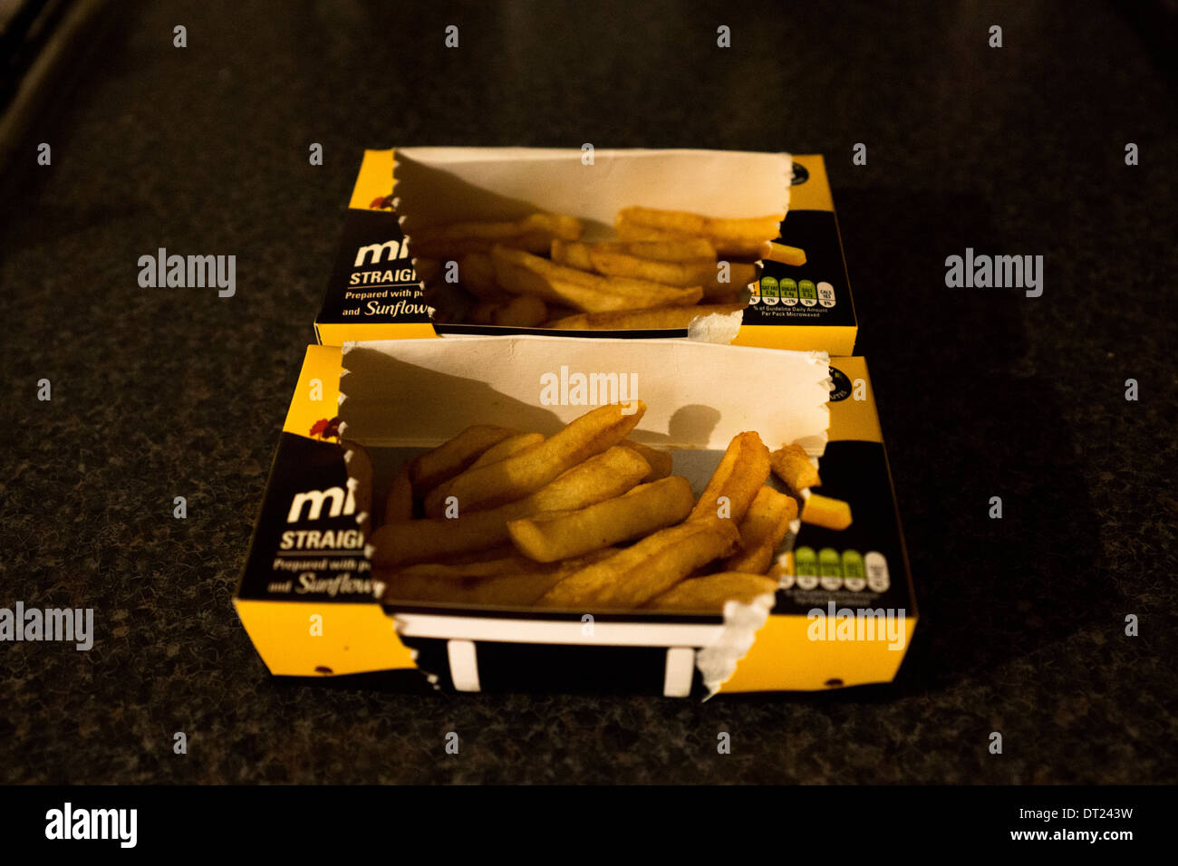 Microwave potato chips frozen fries boxes box Stock Photo - Alamy