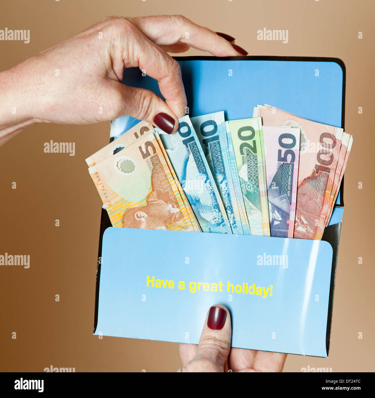 New Zealand dollars in a holiday money wallet Stock Photo