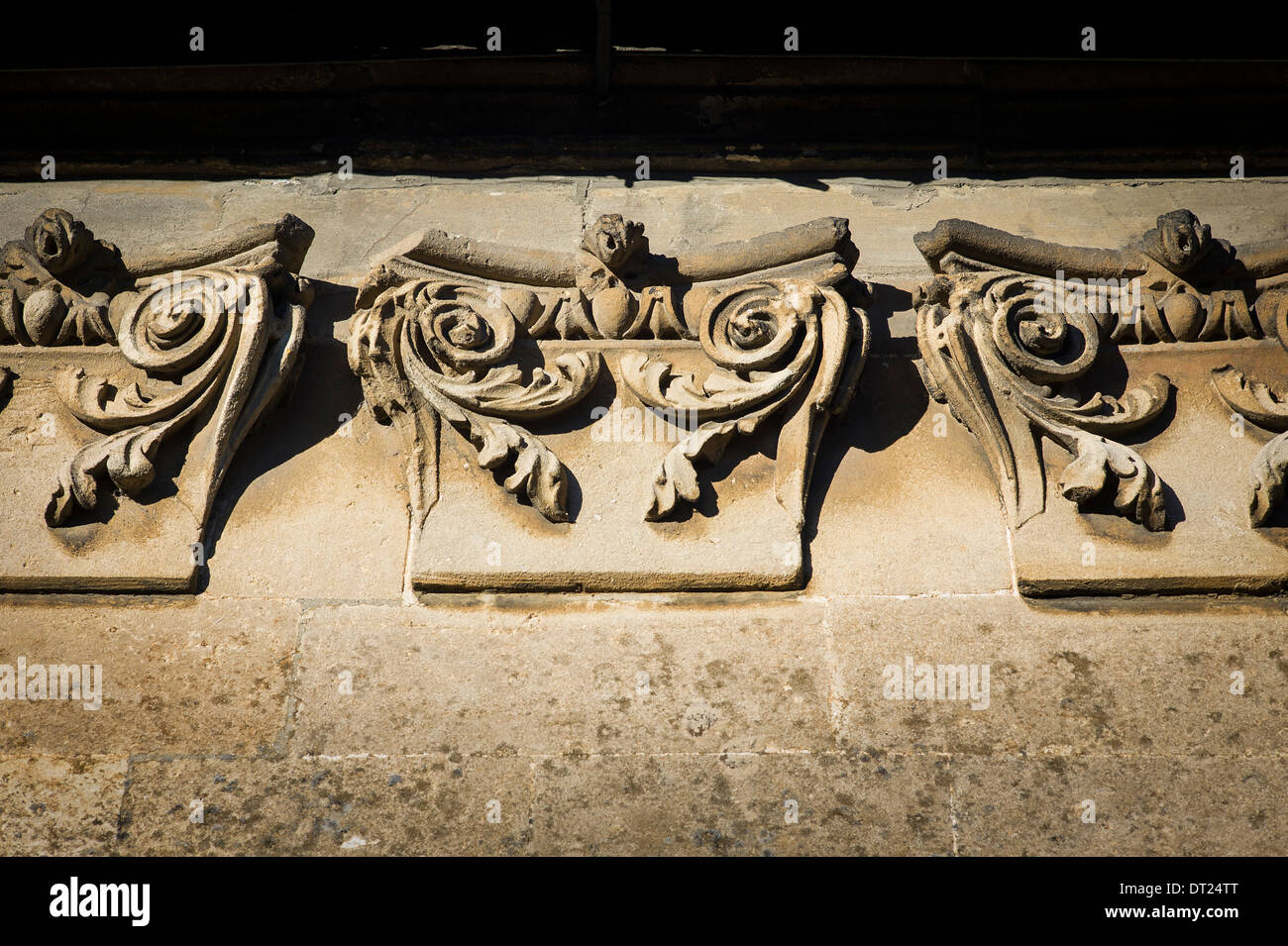 Decorative corbels on stone cottage in Lacock UK Stock Photo