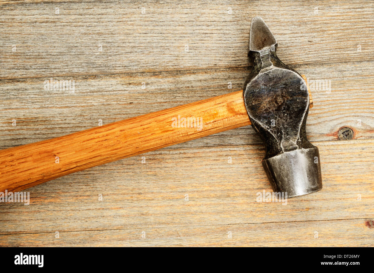 close-up of an old hammer with a wooden handle Stock Photo
