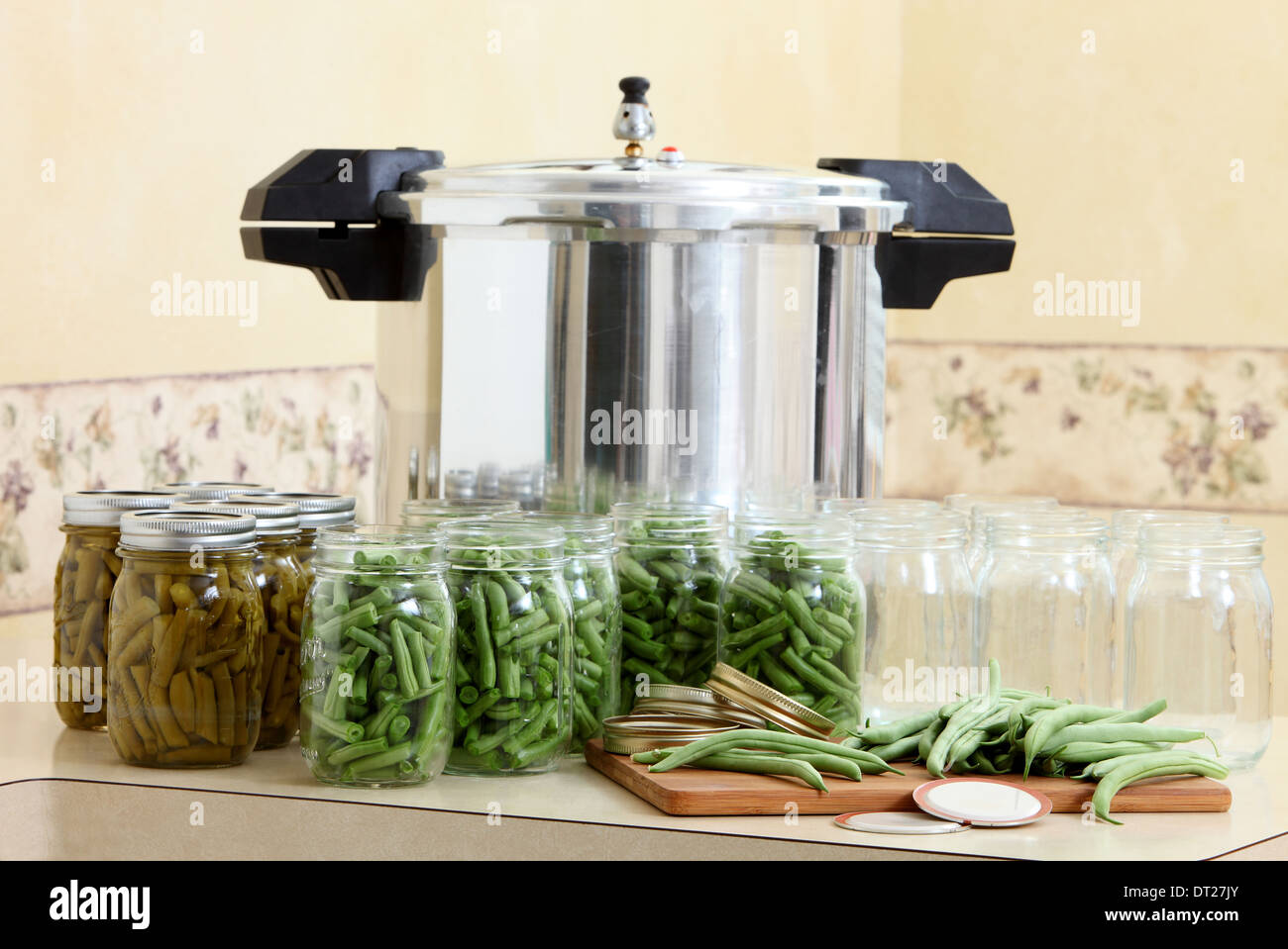 A pressure canner and bottles for preserving beans Stock Photo