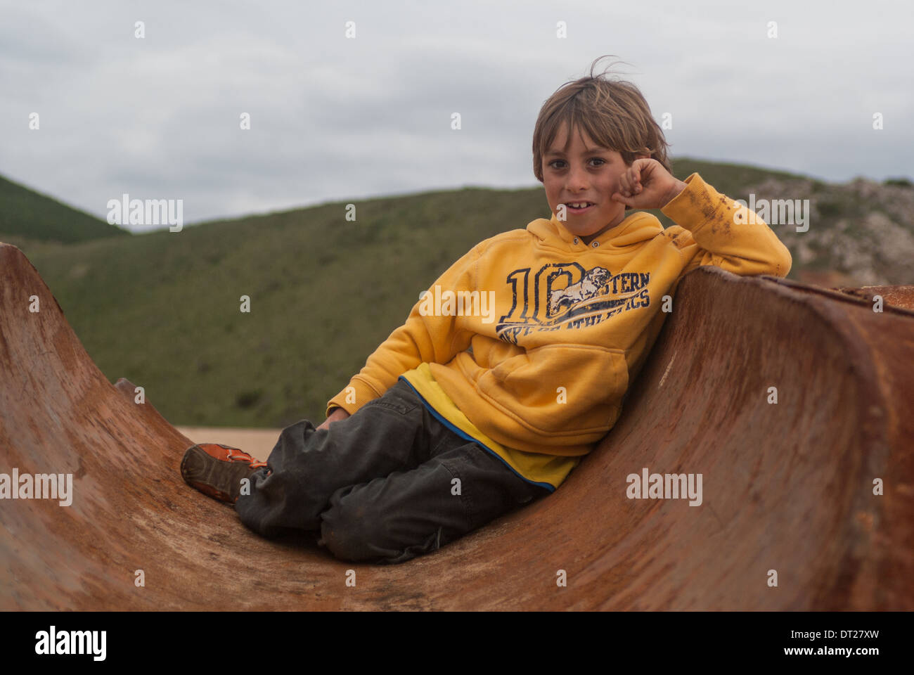 young boy covered in mud Stock Photo