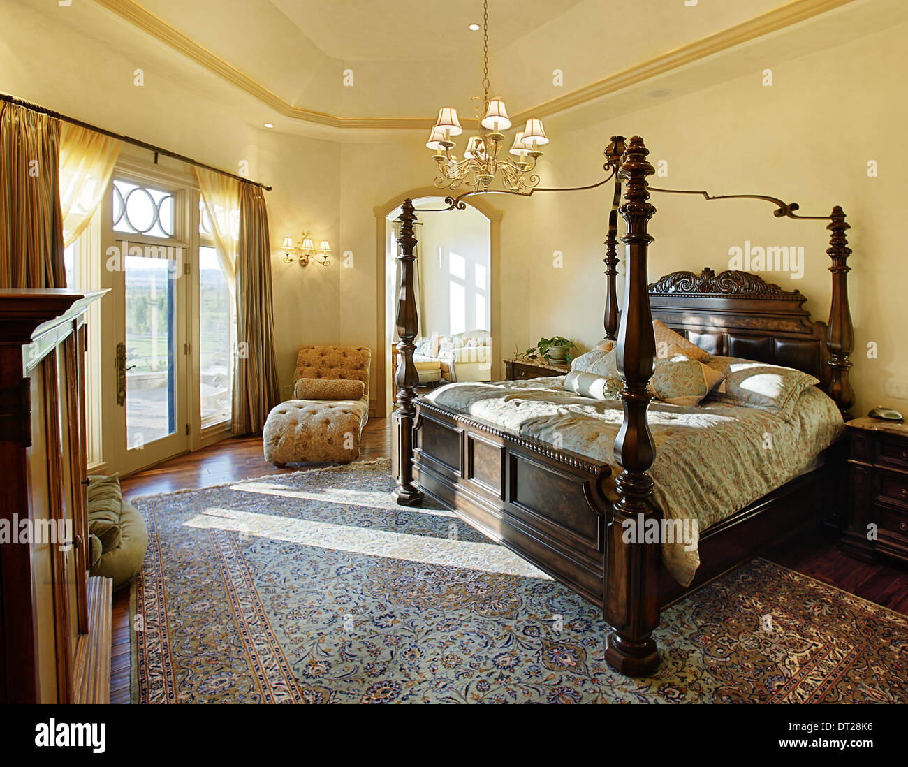 The luxury master bedroom in an upscale residence. Stock Photo