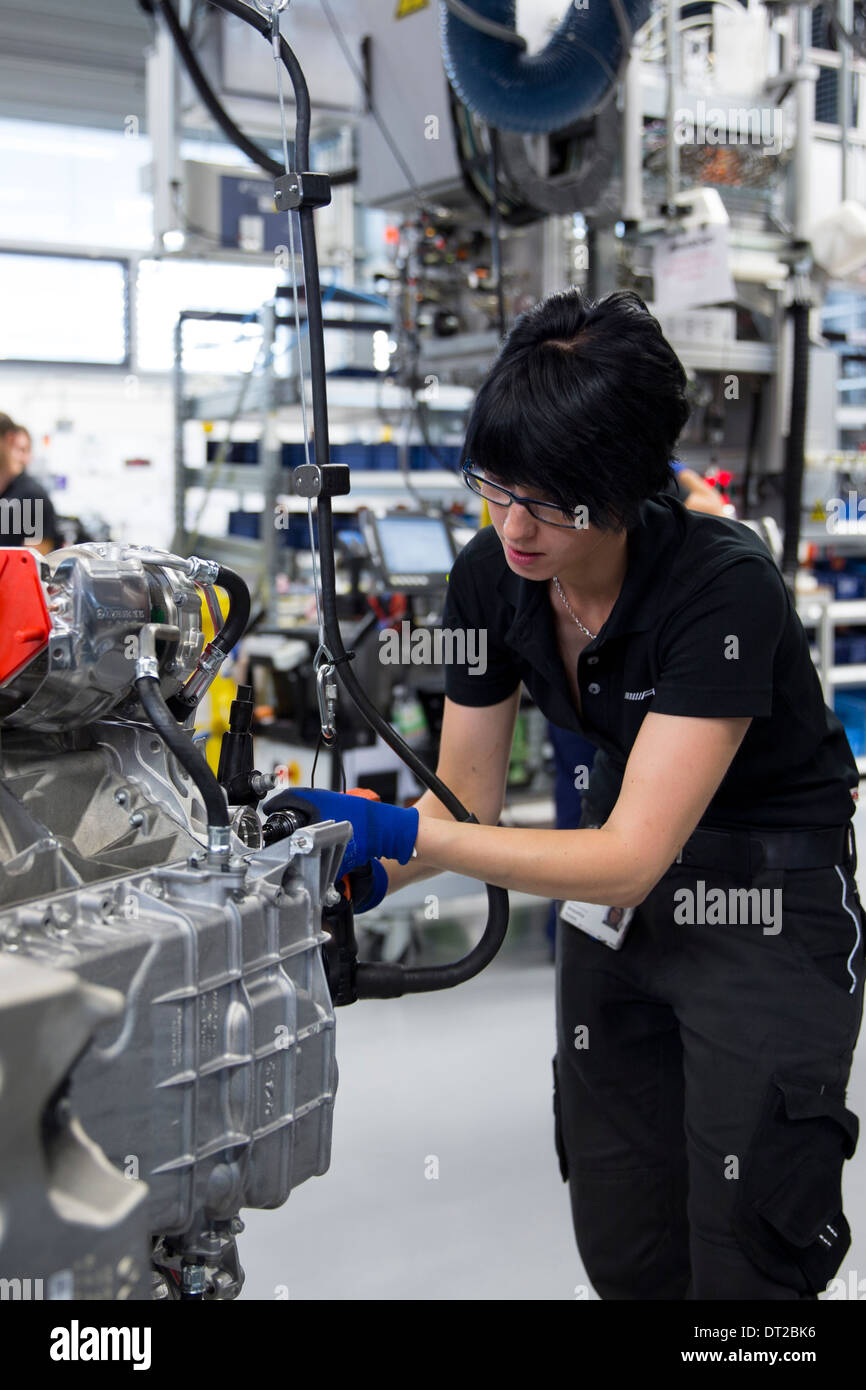 Mercedes-AMG engine production factory in Affalterbach, Germany - female engineer hand-builds a M157 5.5L V8 biturbo engine Stock Photo