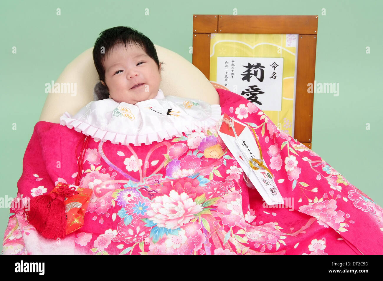 Miyamairi Picture of a Baby Girl with Name written on Kanji in a Frame Stock Photo