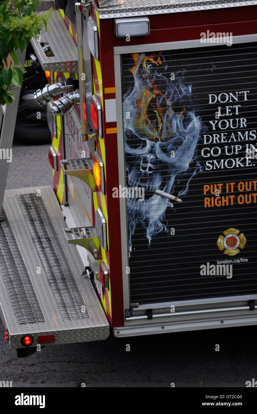 A dire anti-smoking warning on the side of a fire truck, Ontario, Canada. Don’t let your dreams go up in smoke. High risk. Scary. Alarming. Direct Stock Photo