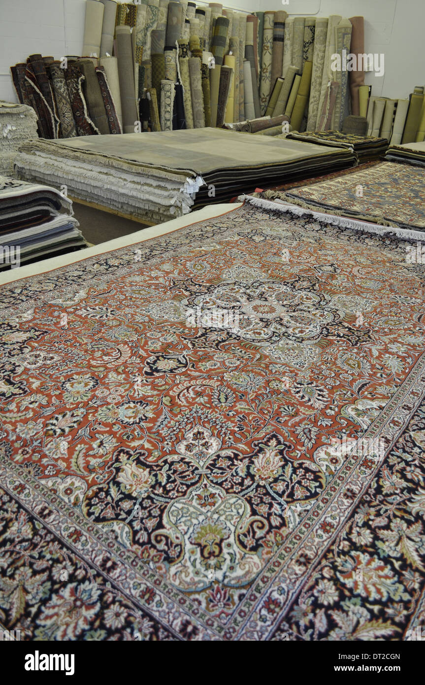 oriental rugs, many handmade and antique, from different countries, on display in a carpet shop Canada Stock Photo