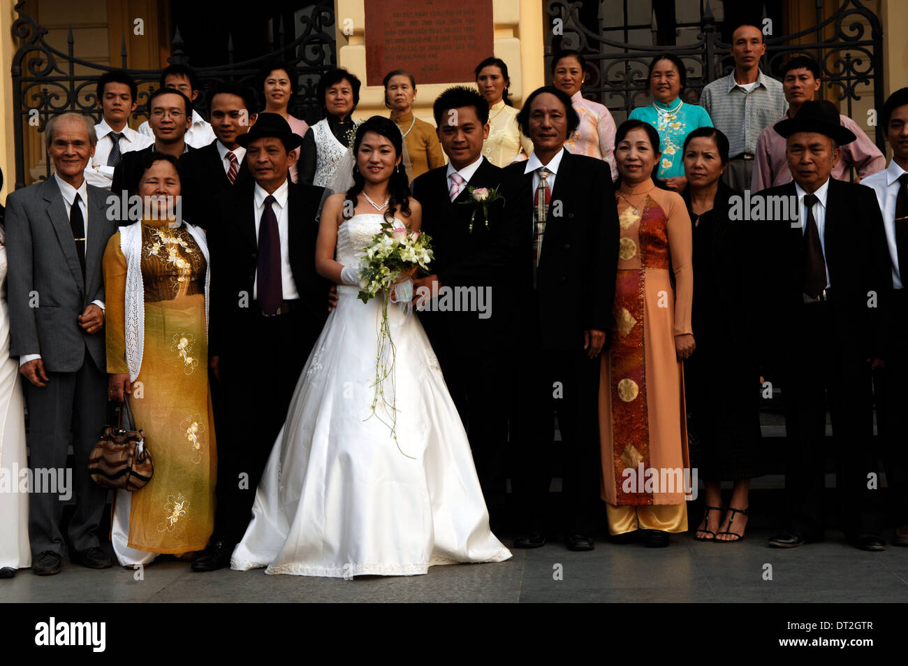 Newlyweds have their photographs taken on the steps of the French built Opera House. Stock Photo