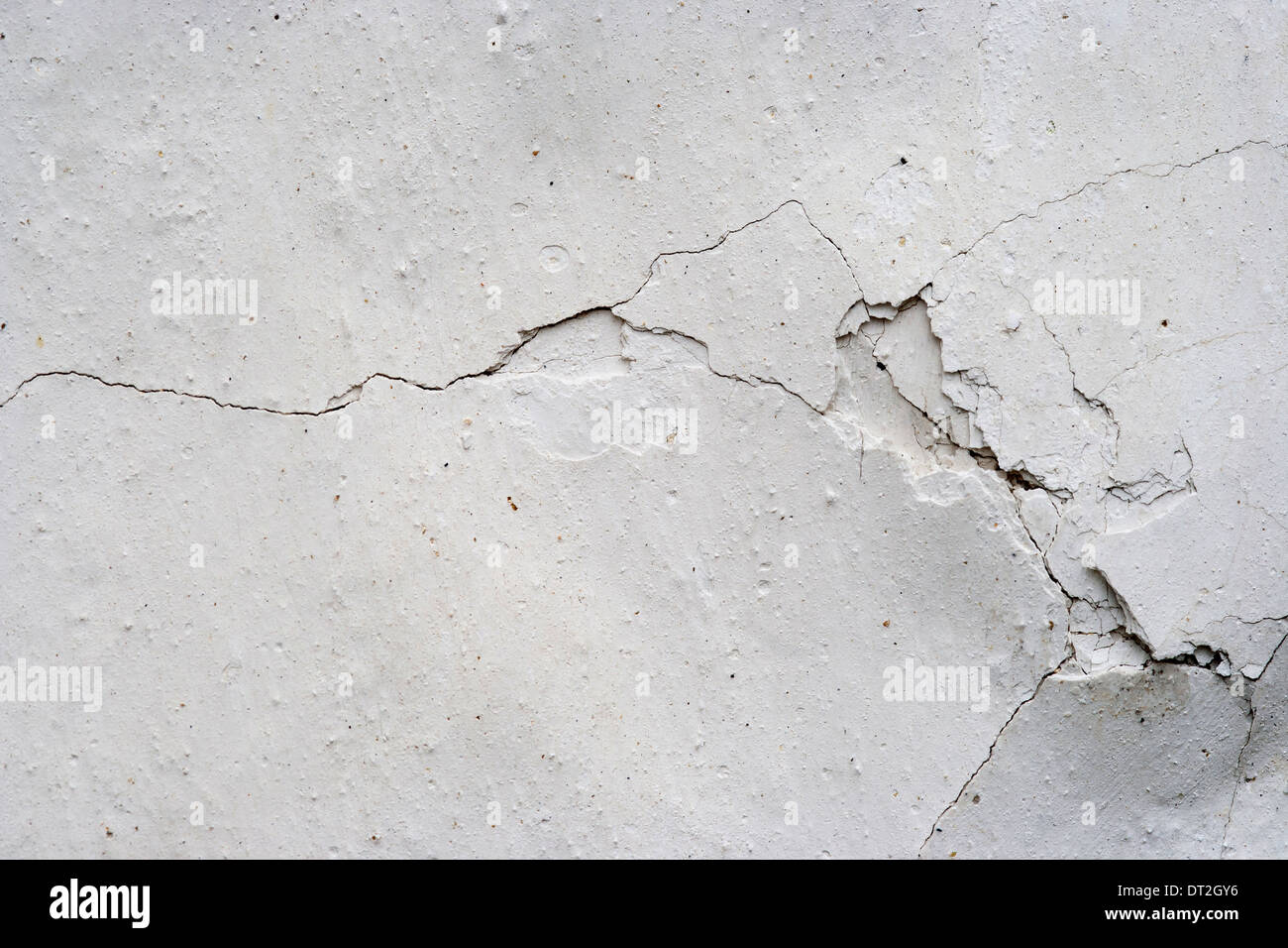 Grunge texture of the old and damaged stucco - plaster - fine cracks Stock Photo