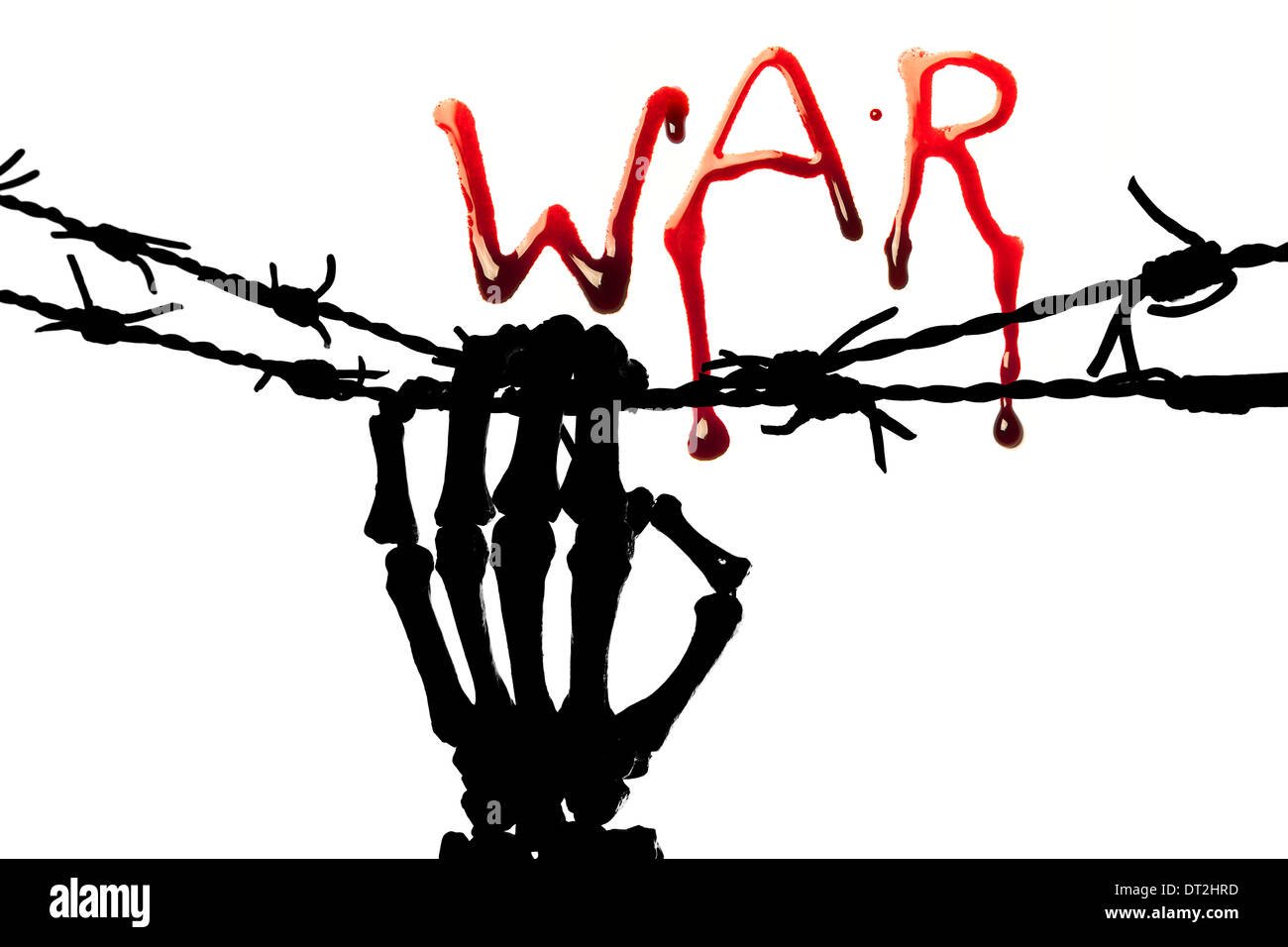 War in bleeding letters and a silhouette of a skeleton hand holding barbed wire Stock Photo