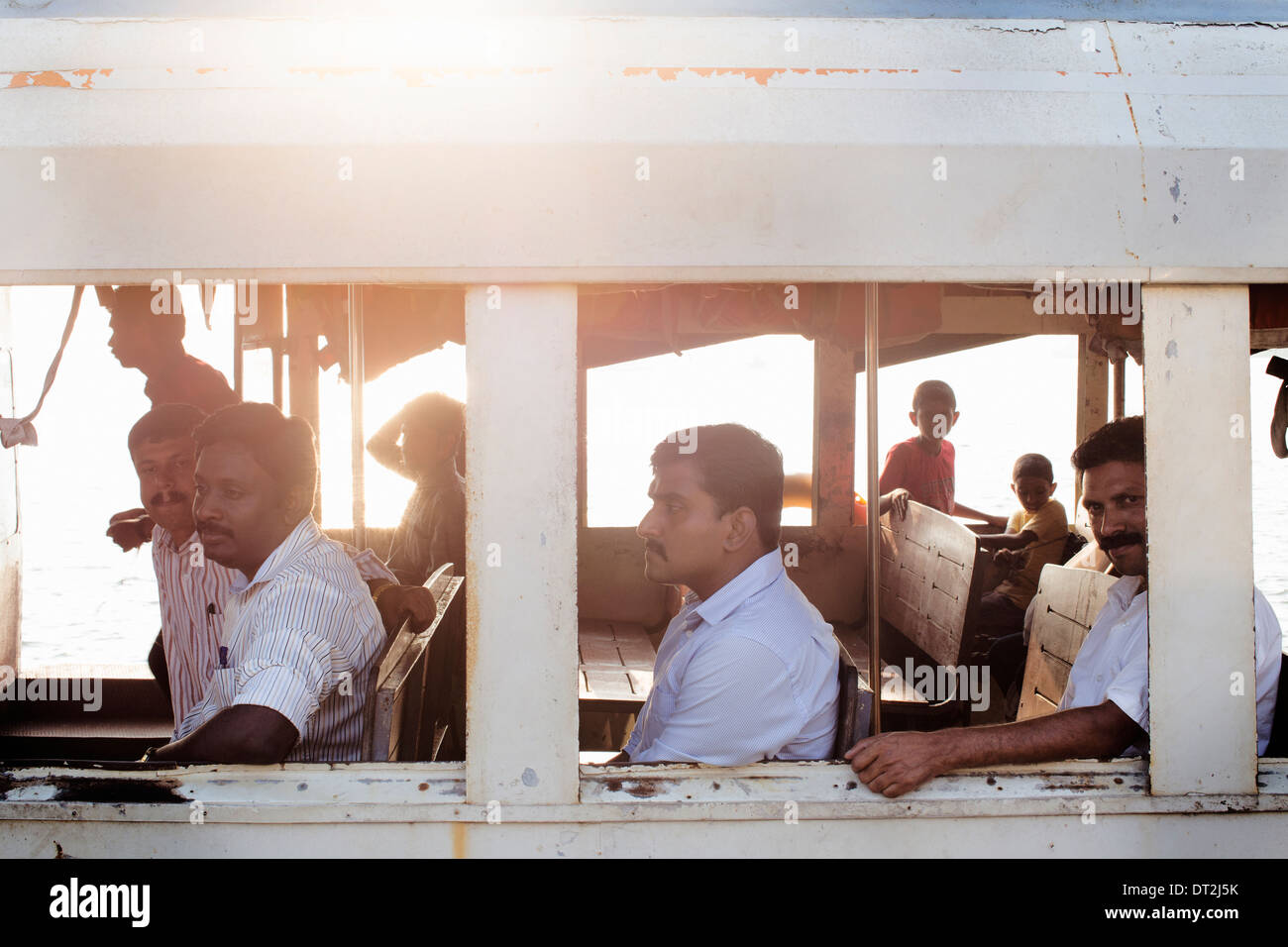 men on ferry in India Stock Photo