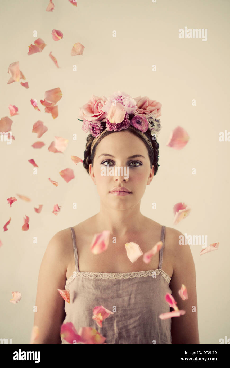 Portrait of young woman wearing flowers Stock Photo