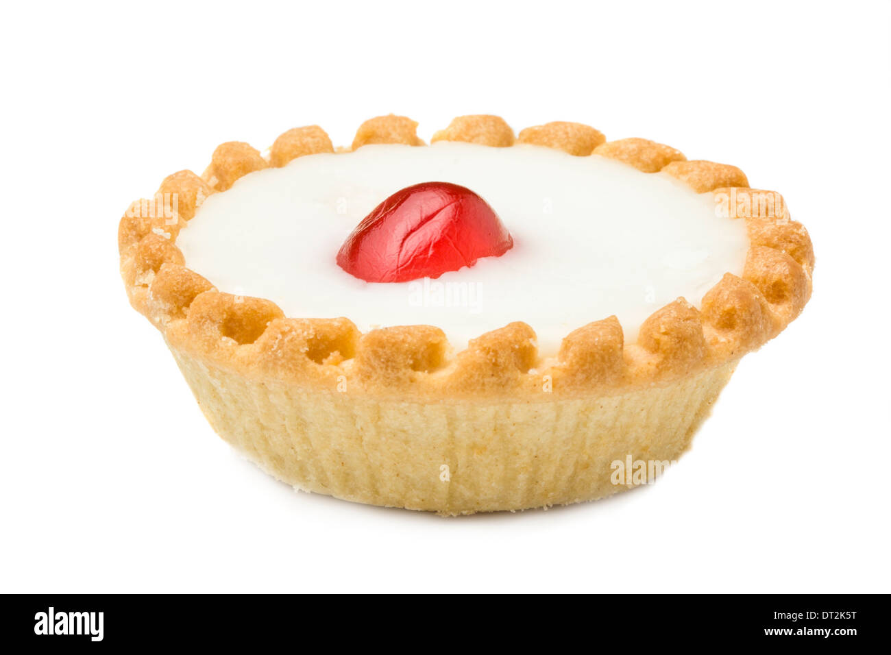 cherry tart cake close up with fondant topping and a candid cherry in the middle The Bakewell Tart is an English confection Stock Photo