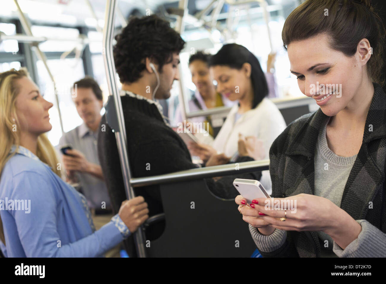 People men and women on a city bus Stock Photo