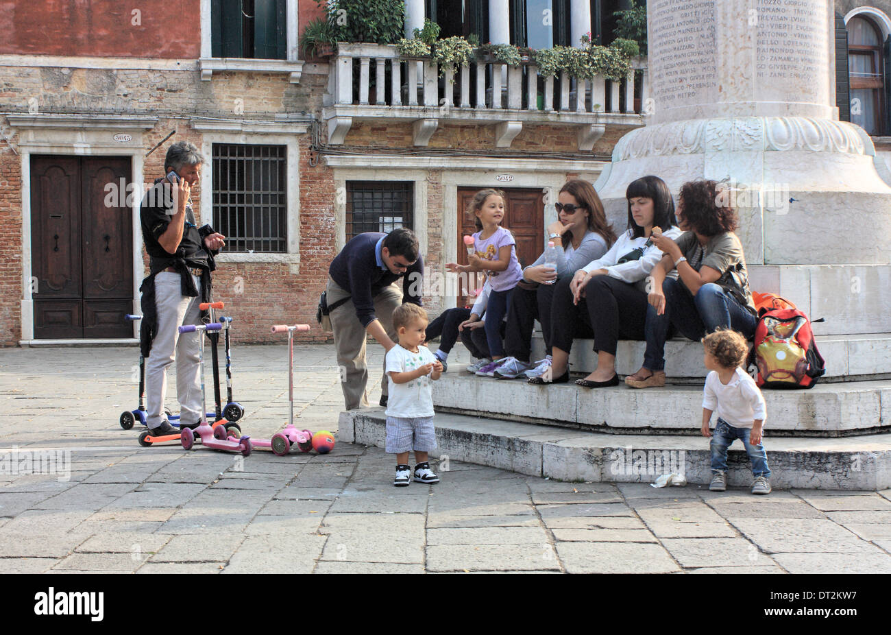 Venetian family. Kids playing at Campo Santa Margherita Stock Photo