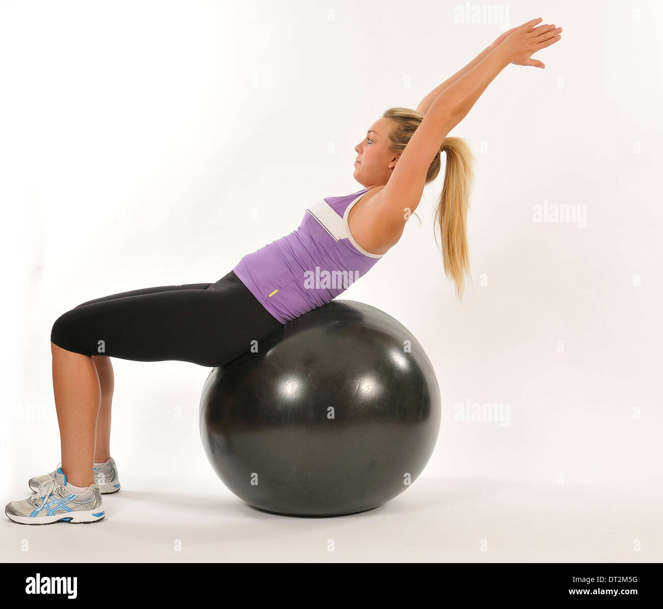 Exercise on fit ball to increase strength and core stability Stock Photo