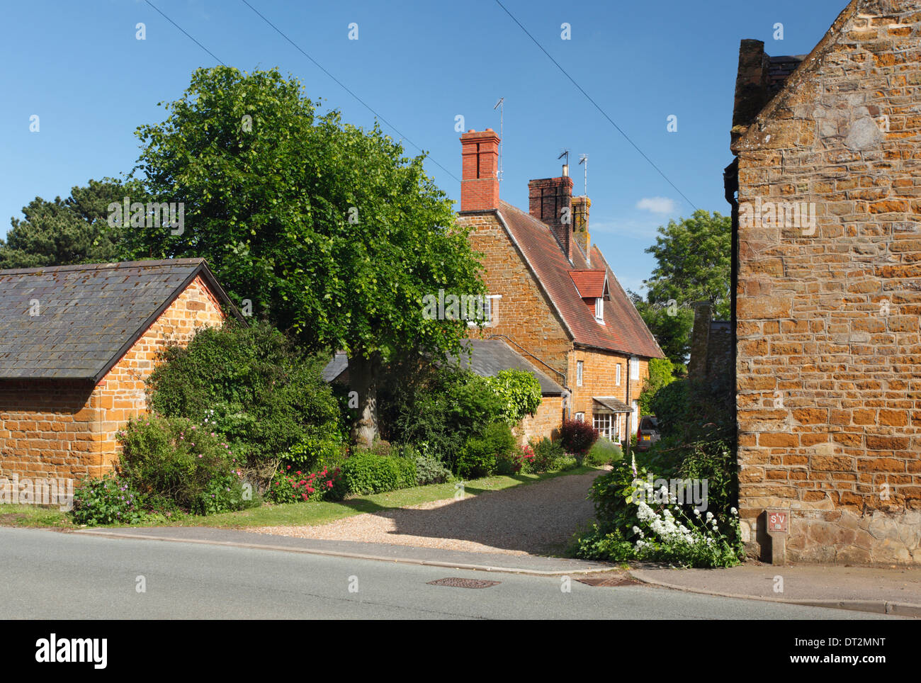 Ironstone Cottages in Great Brington. Northamptonshire. England. UK. Stock Photo
