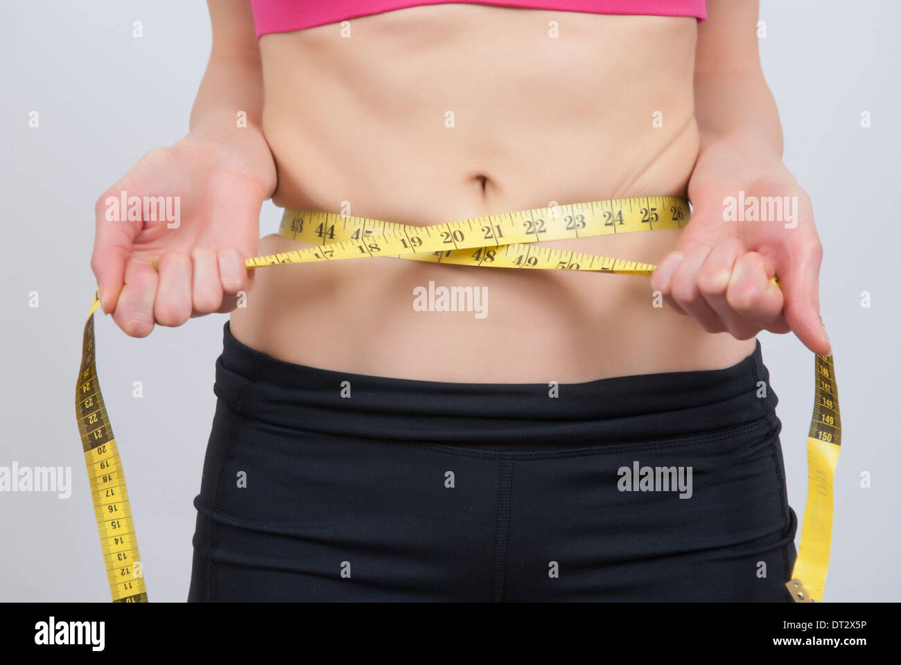 Woman measuring waist tape measure hi-res stock photography and images -  Page 3 - Alamy