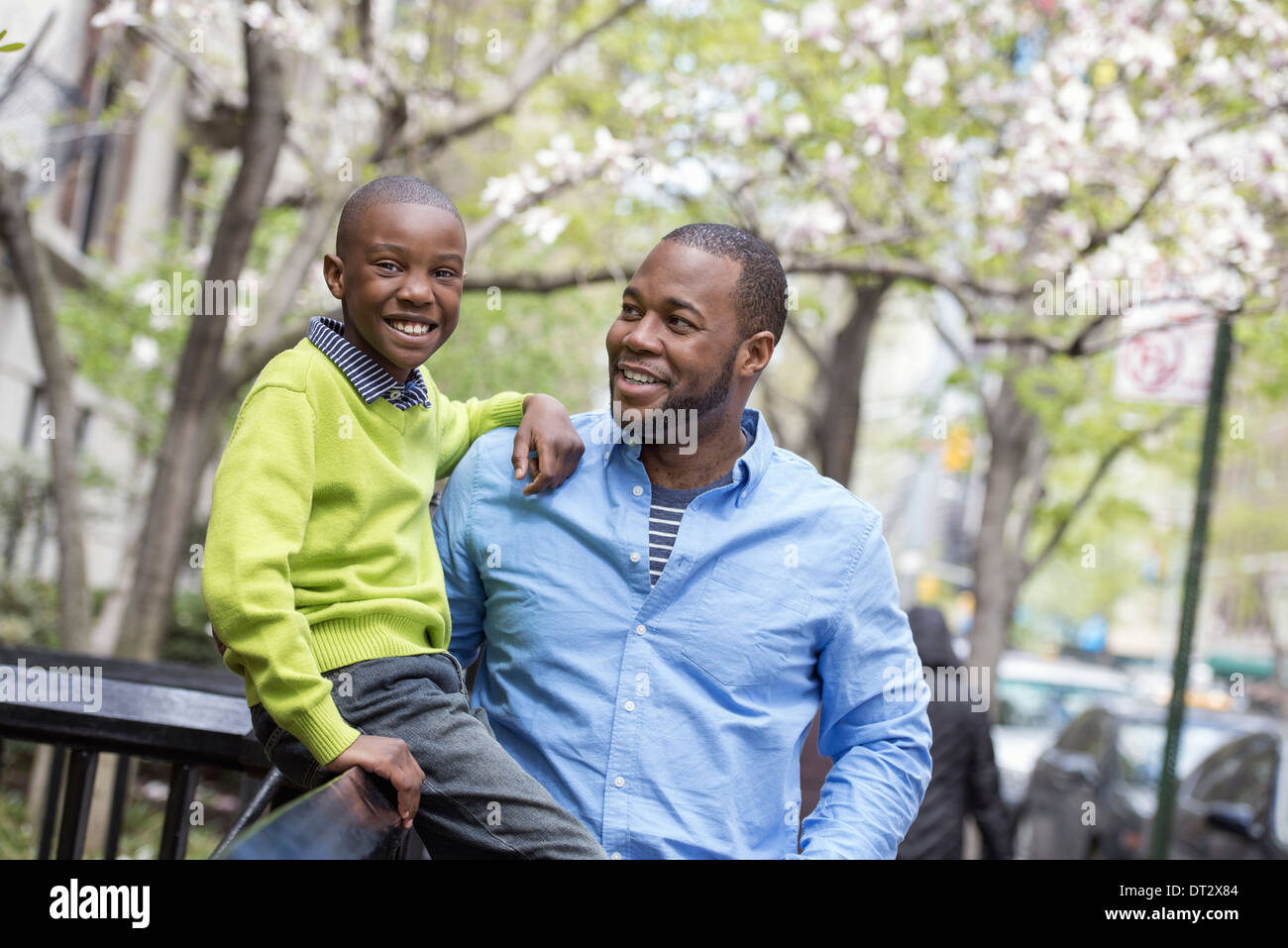 Father son sitting on park hi-res stock photography and images - Alamy