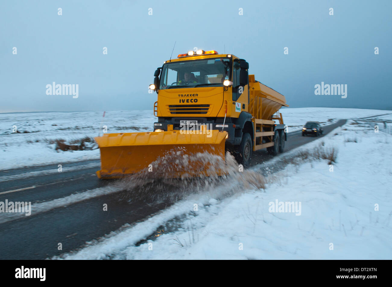 Mynydd Epynt, Powys, Wales, UK. 7th February 2014. Gritting trucks are out early on the road between Builth Wells and Brecon. Snow fell last night on high land in Mid-Wales. Credit:  Graham M. Lawrence/Alamy Live News. Stock Photo