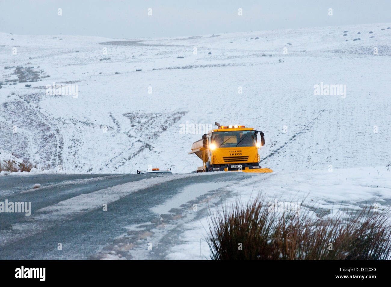 Mynydd Epynt, Powys, Wales, UK. 7th February 2014. Gritting trucks are out early on the road between Builth Wells and Brecon. Snow fell last night on high land in Mid-Wales. Credit:  Graham M. Lawrence/Alamy Live News. Stock Photo
