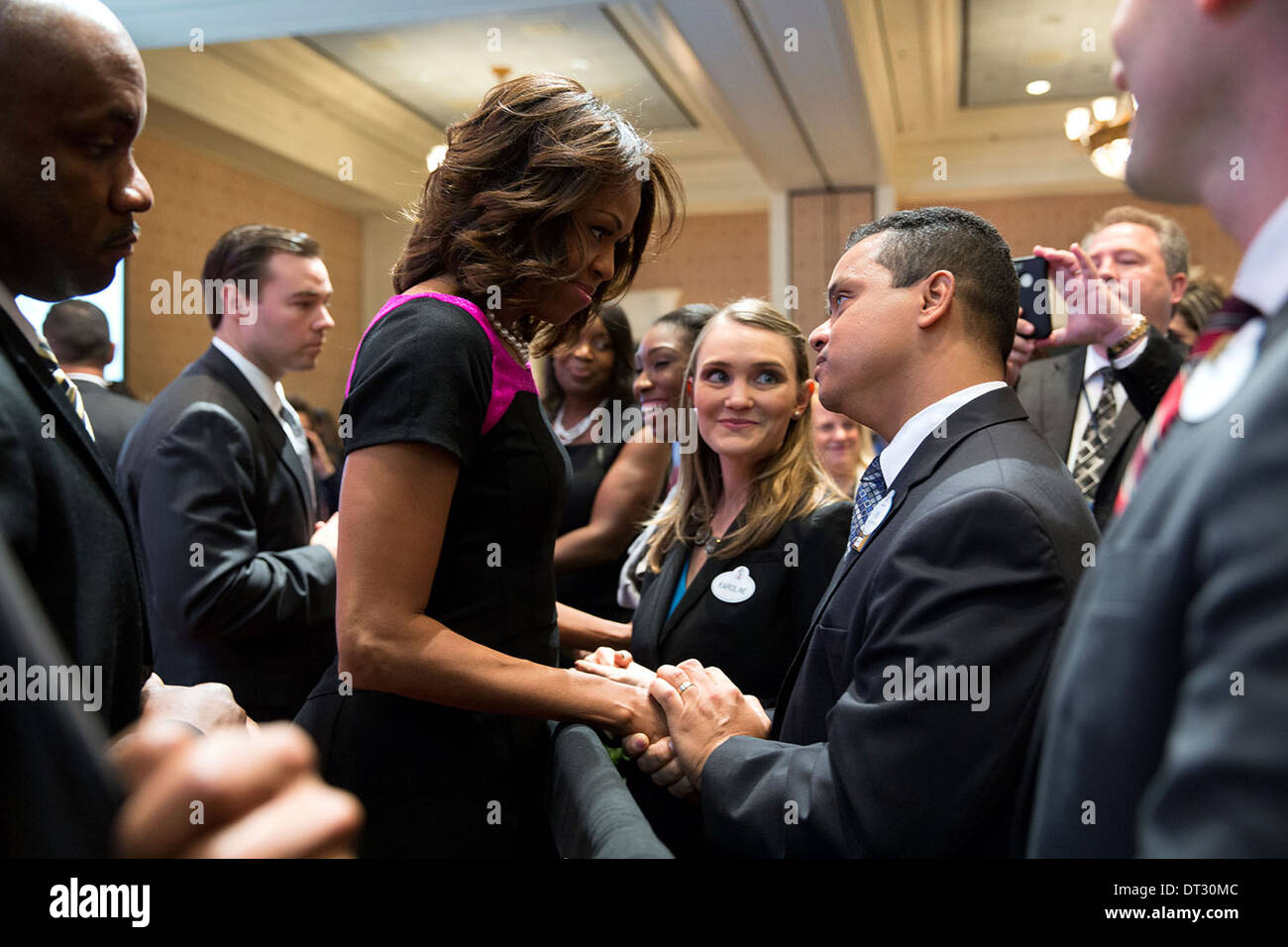 US First Lady Michelle Obama greets attendees after she delivers the keynote address at Disney's Veterans Institute Workshop at the Walt Disney World Resort November 14, 2013 in Orlando, FL. Stock Photo