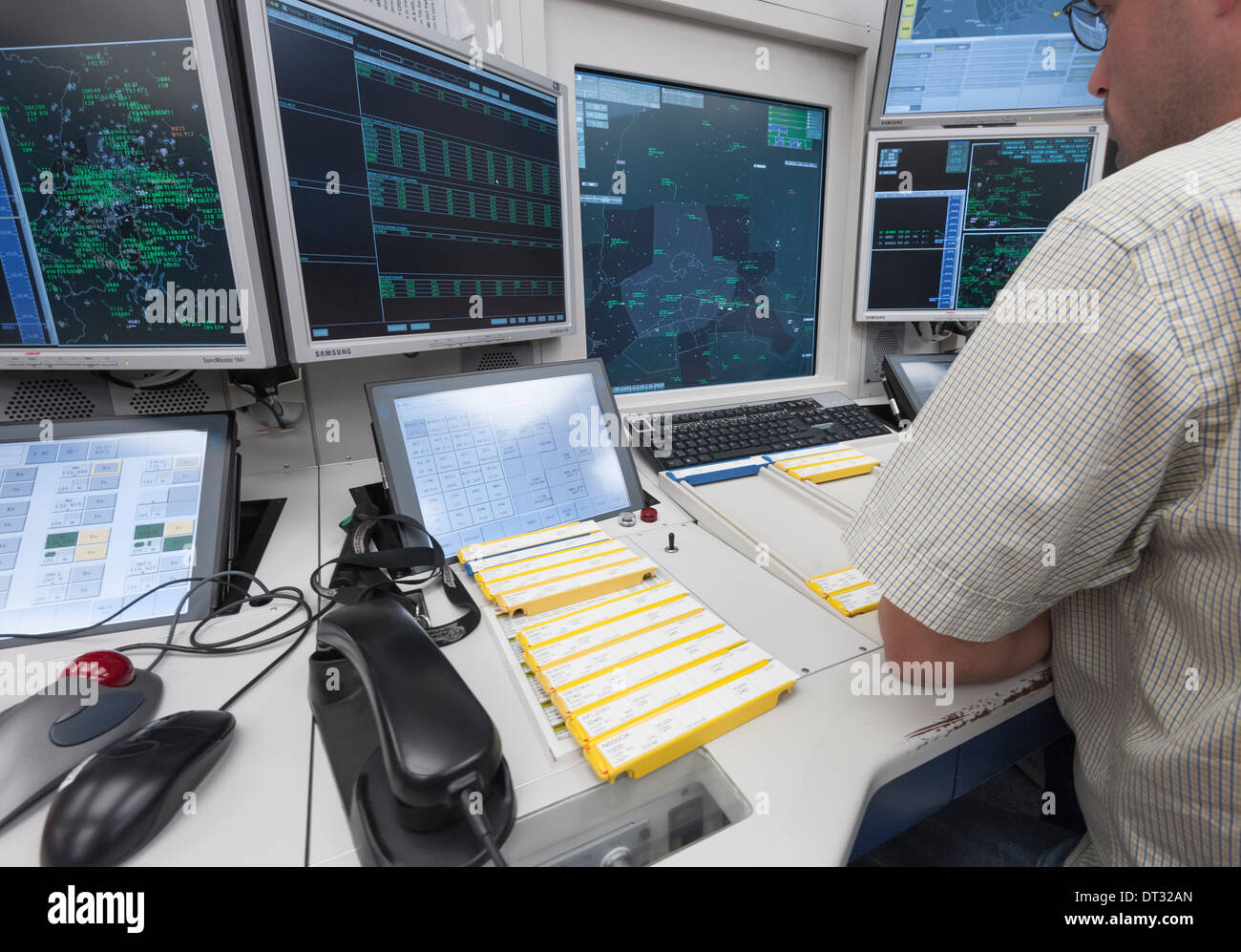 The desk of an air traffic controller in an air traffic control centre Stock Photo