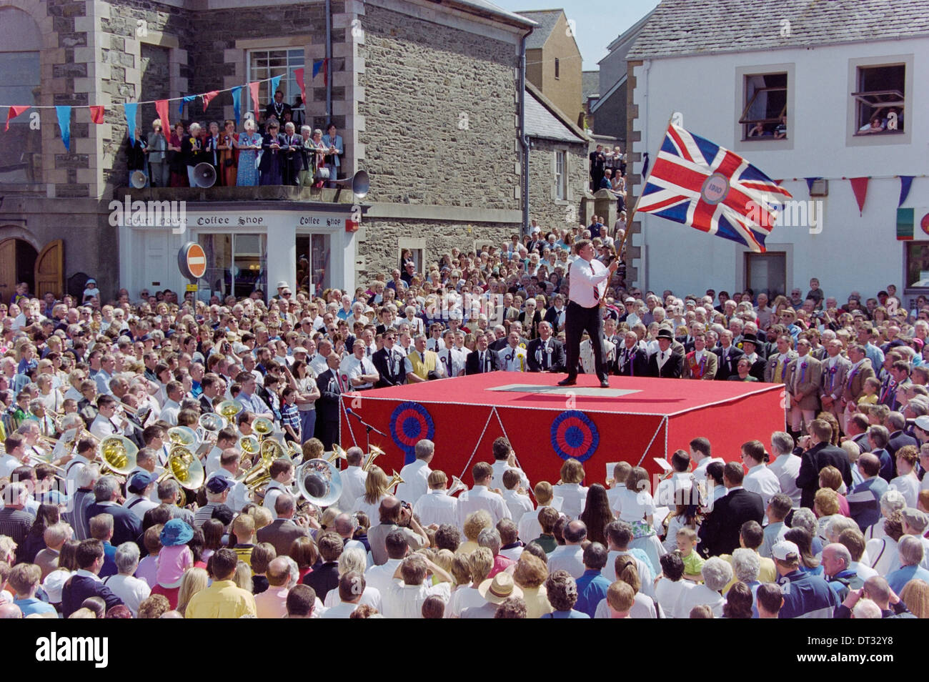 Selkirk Common Riding. A standard bearer casting the colours in Selkirk's Ancient Market Place. Stock Photo