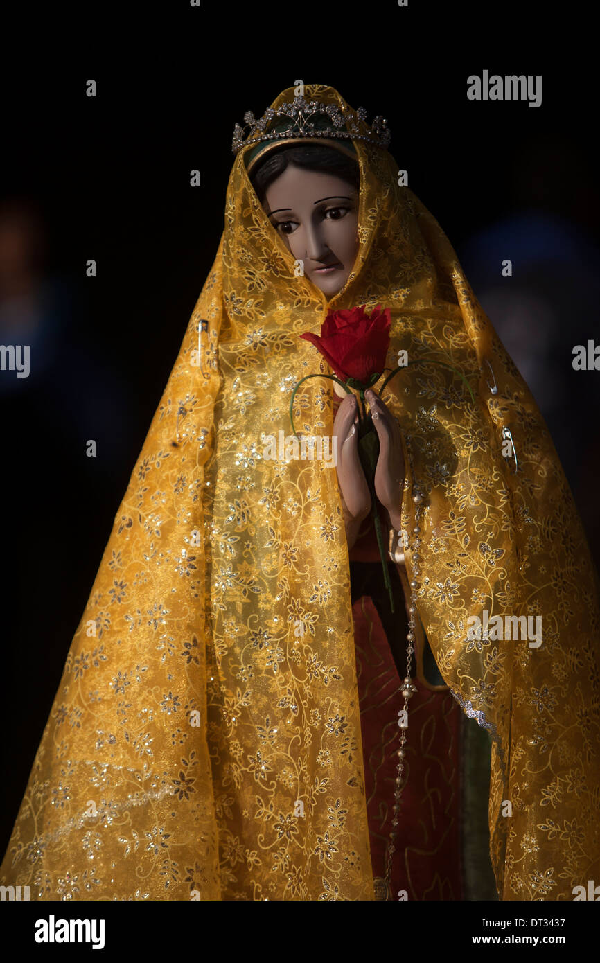An image of the Virgin of Guadalupe wearing yellow clothes at the Our Lady  of Guadalupe Basilica in Mexico Stock Photo - Alamy