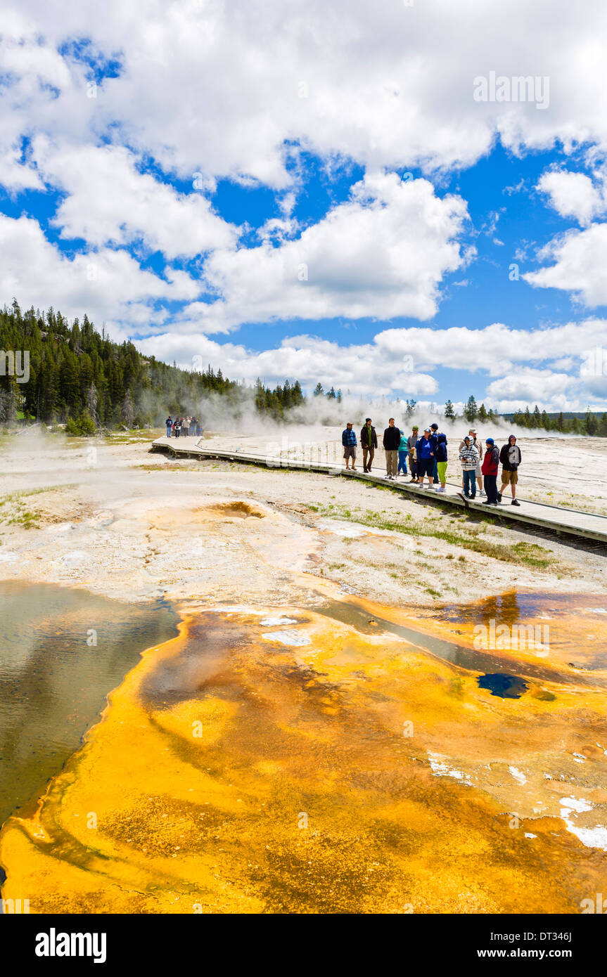 Tourists on the trail at Geyser Hll, Upper Geyser Basin, Yellowstone National Park, Wyoming, USA Stock Photo