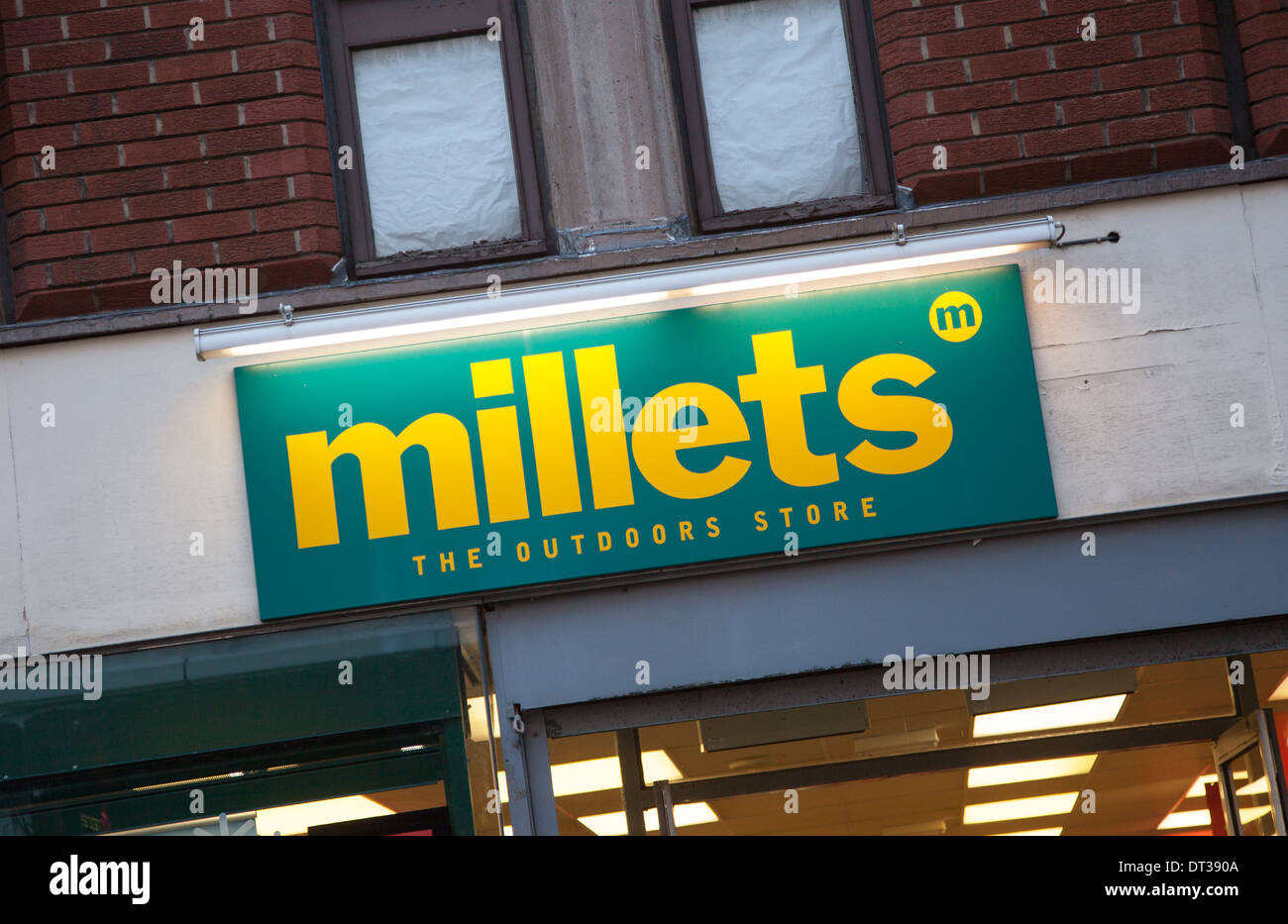 Sign on the front frontage or facade of the Millets Outdoors store in Macclesfield Cheshire England UK Stock Photo