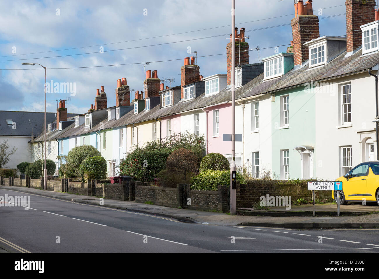A row of brightly coloured terraced houses in orchard street outside of