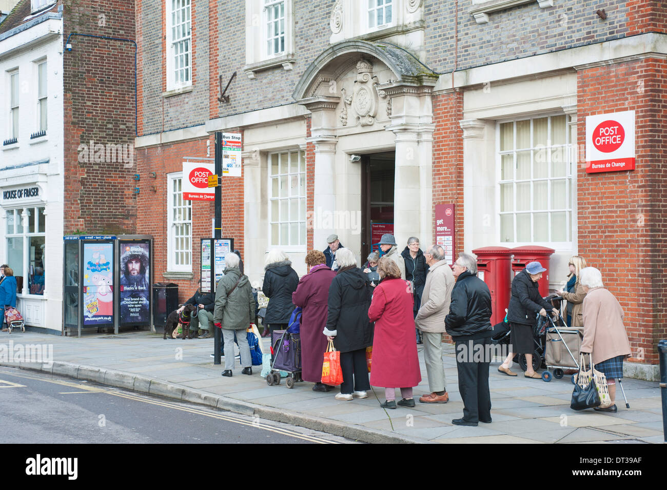 Elderly Members Of The Public Queuing For A Stagecoach Bus Outside Of Stock Photo Alamy