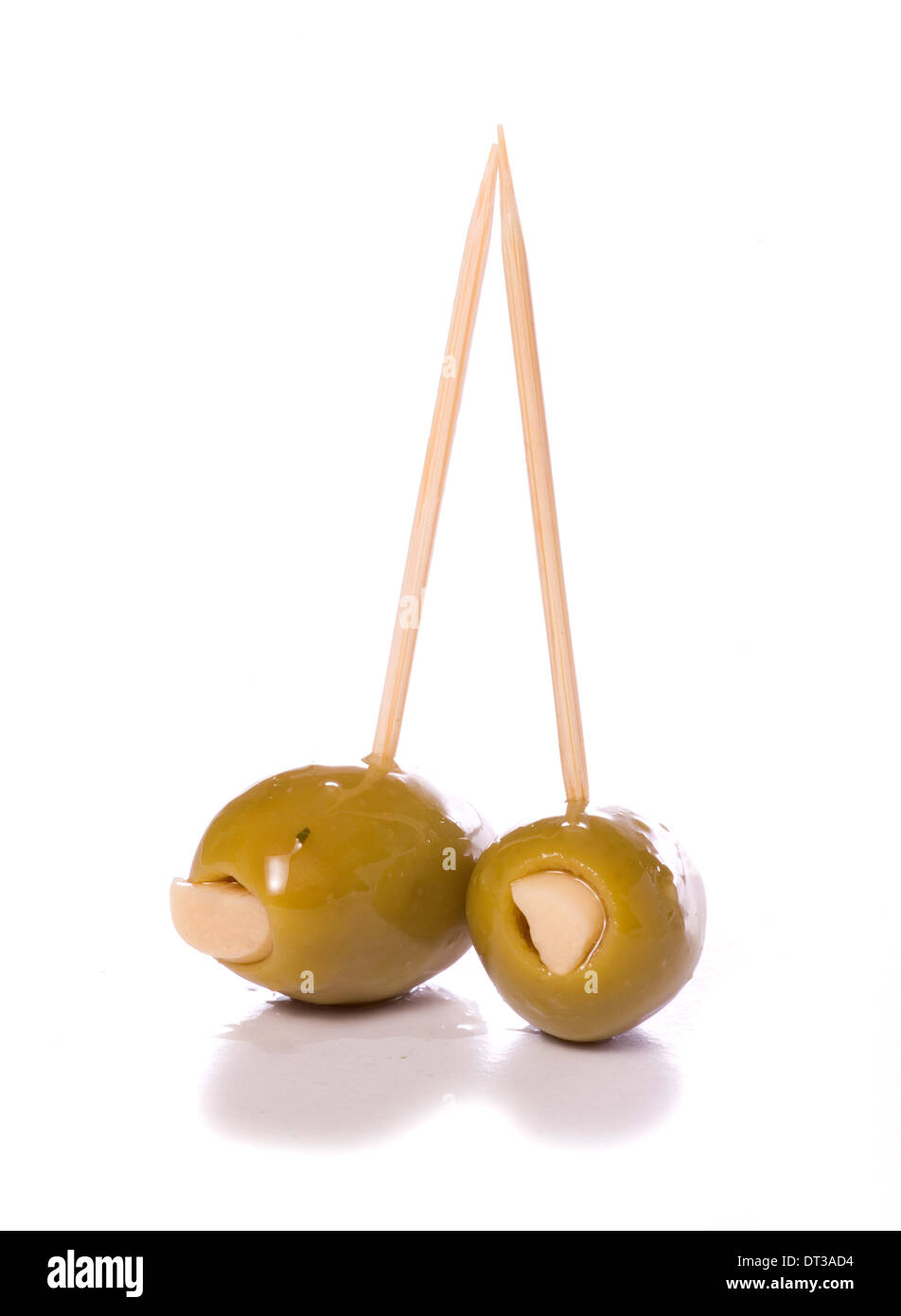 two garlic stuffed green olives cutout Stock Photo Alamy