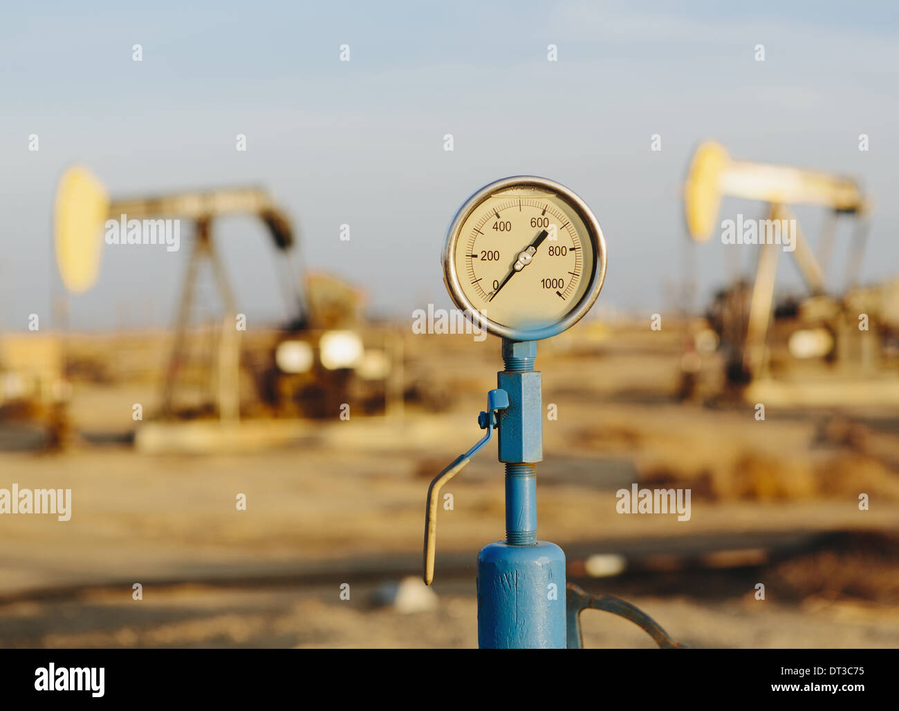 Air pressure gauge, oil rigs in background, Sunset-Midway oil fields, the largest in California. Stock Photo