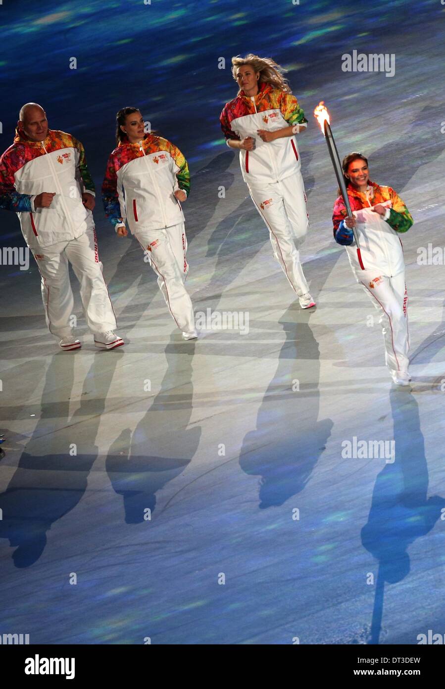 Sochi, Russia. 07 February 2014. Alina Kabaeva (R) of Russia carries the Olympic torch as Alexandr Karelin (L), Russian pole vaulter Yelena Isinbayeva (2-L) and tennis player Maria Sharapova of Russia follow during the Opening Ceremony in Fisht Olympic Stadium at the Sochi 2014 Olympic Games, Sochi, Russia, 07 February 2014. Photo: Christian Charisius/dpa in Fisht Olympic Stadium at the Sochi 2014 Olympic Games, Sochi, Russia, 07 February 2014. Photo: Christian Charisius/dpa/Alamy Live News Stock Photo