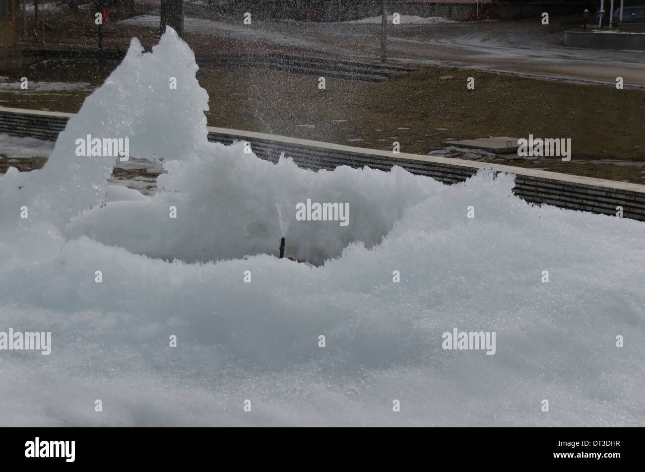 Frozen fountain in mountain in winter, Rila mountain, Borovetz Stock Photo