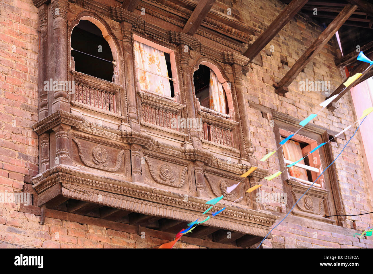 Traditional newari style-richly carved-three body wooden balcony. Street of Patan-Lalitpur district-Nepal. 0122 Stock Photo