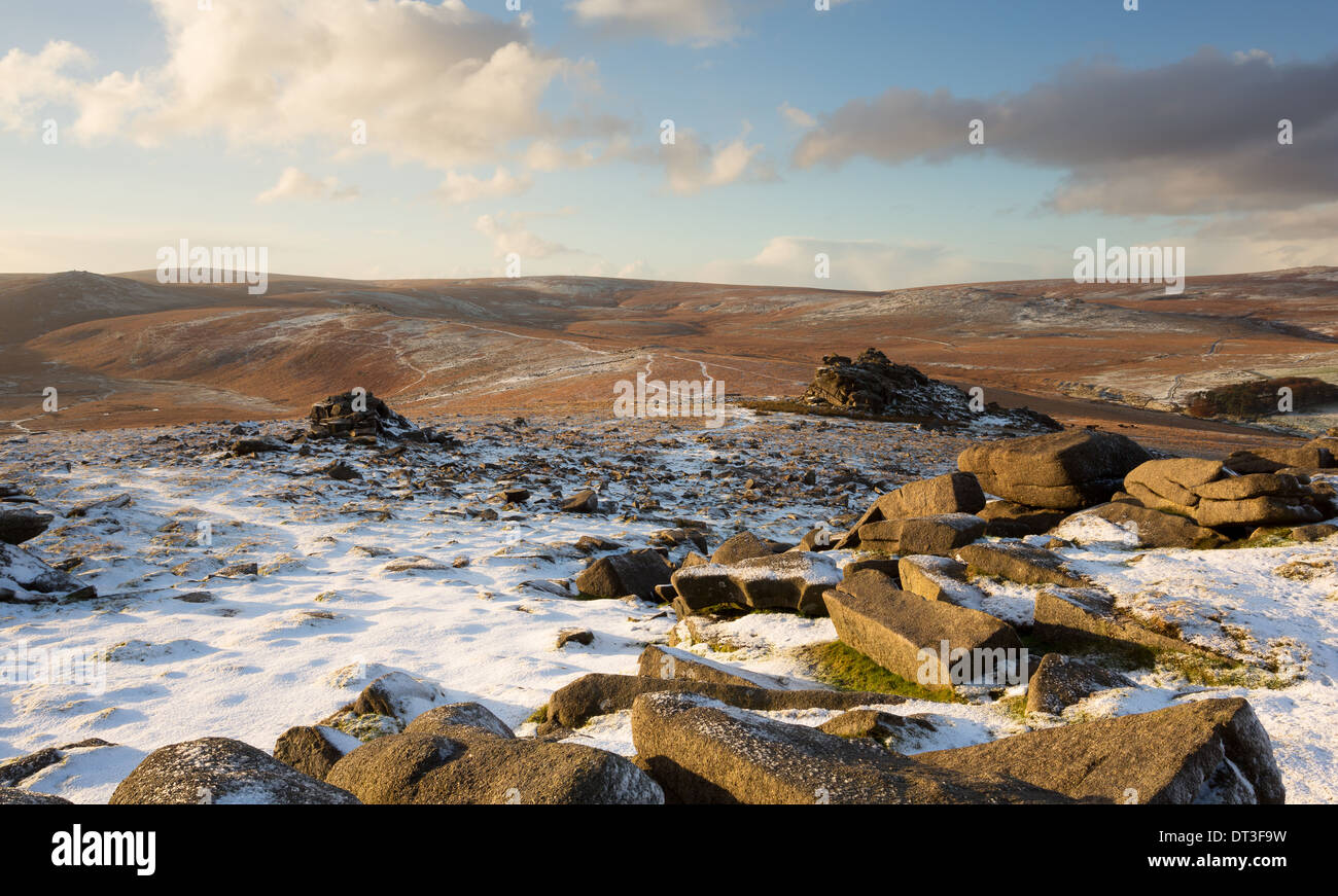 A light dusting of snow on Belstone tor with views towards Steeperton tor Dartmoor national park Devon Uk Stock Photo