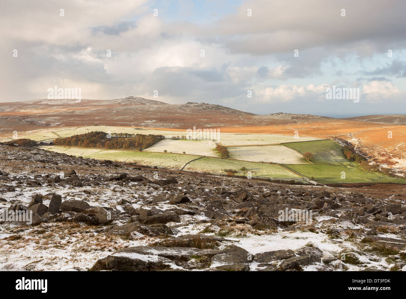 A light dusting of snow on Belstone tor with views towards Yes tor  Dartmoor national park Devon Uk Stock Photo