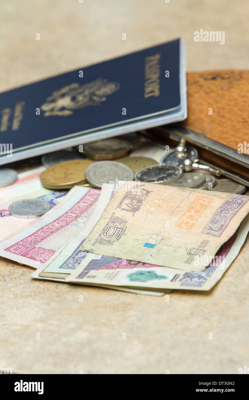 travel documents and different international currencies on a counter